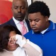 Parents grieving at a press conference following the death of their newborn during delivery. Parents grieving at a press conference following the death of their newborn during delivery.