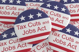 Buttons featuring the text "Tax Cuts and Jobs Act" on a patriotic red, white, and blue background.