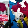 Protesters holding signs against gerrymandering outside the U.S. Supreme Court. Protesters holding signs against gerrymandering outside the U.S. Supreme Court.