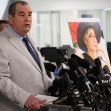 A lawyer speaking at a press conference with a photo of cinematographer Halyna Hutchins in the background. A lawyer speaking at a press conference with a photo of cinematographer Halyna Hutchins in the background.