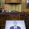 A congressional hearing on antitrust violations featuring a video call with a tech CEO. A congressional hearing on antitrust violations featuring a video call with a tech CEO.