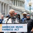 Dionne Warwick speaking at a press conference for the American Music Fairness Act, with a group of supporters in the background, outside the U.S. Capitol. Dionne Warwick speaking at a press conference for the American Music Fairness Act, with a group of supporters in the background, outside the U.S. Capitol.