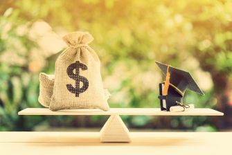 A scale balancing a bag of money and a graduation cap with a diploma, symbolizing the relationship between student debt and education.