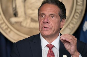 Former New York Governor Andrew Cuomo speaking during a press conference.