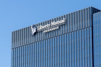 Signage of Liberty Mutual Insurance on the exterior of a modern building.