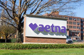 Aetna sign outside a corporate office building.
