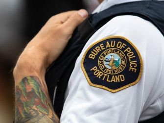 Portland Police Bureau patch on an officer's uniform.