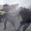 Clashes between law enforcement and protesters during the January 6 Capitol riot, highlighting the chaos and violence of the day. Clashes between law enforcement and protesters during the January 6 Capitol riot, highlighting the chaos and violence of the day.