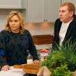 Todd and Julie Chrisley from the reality series "Chrisley Knows Best" looking concerned while standing in their kitchen. Todd and Julie Chrisley from the reality series "Chrisley Knows Best" looking concerned while standing in their kitchen.