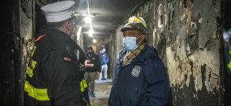 Emergency officials assess damage and discuss next steps after a deadly fire at a Bronx apartment complex.