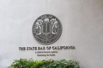 The seal of the State Bar of California displayed on a building wall.