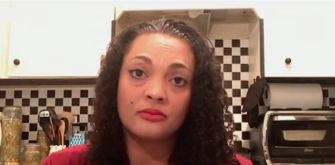 Mother discussing lawsuit against charter school over curriculum issues.