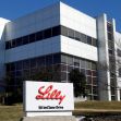Exterior of the Eli Lilly corporate building with a sign displaying the company name and address. Exterior of the Eli Lilly corporate building with a sign displaying the company name and address.