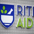 Rite Aid store sign on a brick wall. Rite Aid store sign on a brick wall.
