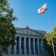 California courthouse with the state flag flying in front. California courthouse with the state flag flying in front.