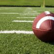 A football on a field, symbolizing a high school football game where a shooting incident occurred. A football on a field, symbolizing a high school football game where a shooting incident occurred.