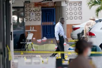 A police investigation scene outside El Mula Banquet Hall following a shooting incident in Florida.