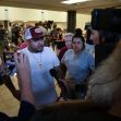 A man speaking to the media surrounded by several individuals after the release of the Uvalde school shooting investigation report. A man speaking to the media surrounded by several individuals after the release of the Uvalde school shooting investigation report.