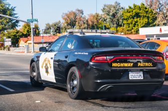 California Highway Patrol vehicle at an intersection.