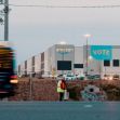 Amazon fulfillment center in Bessemer, Alabama, with a "VOTE" banner visible on the building during a unionization vote. Amazon fulfillment center in Bessemer, Alabama, with a "VOTE" banner visible on the building during a unionization vote.