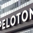 Sign displaying the name "Peloton" on a building. Sign displaying the name "Peloton" on a building.