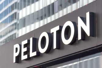 Sign displaying the name "Peloton" on a building.