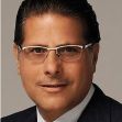 Portrait of a man in a suit with glasses, involved in a financial fraud case. Portrait of a man in a suit with glasses, involved in a financial fraud case.