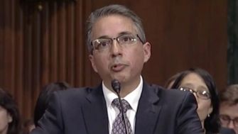 A federal judge delivering a statement during a court session regarding the use of the Alien Enemies Act.