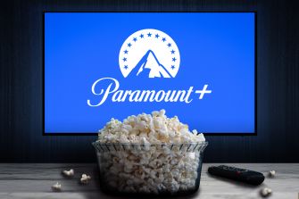 A bowl of popcorn in front of a television displaying the Paramount+ logo.