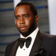 Sean Combs posing in formal attire at an event. Sean Combs posing in formal attire at an event.