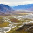 A scenic view of the Arctic National Wildlife Refuge, showcasing its diverse landscapes of mountains, rivers, and valleys. A scenic view of the Arctic National Wildlife Refuge, showcasing its diverse landscapes of mountains, rivers, and valleys.