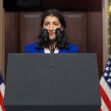Lina Khan, FTC Chair, speaking at a podium with American flags in the background. Lina Khan, FTC Chair, speaking at a podium with American flags in the background.