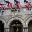 Trump International Hotel with American flags displayed prominently outside the building. Trump International Hotel with American flags displayed prominently outside the building.