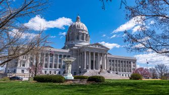 Exterior view of the Missouri State Capitol building on a sunny day.