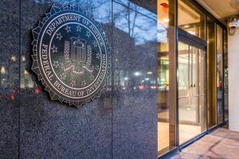 Seal of the Federal Bureau of Investigation (FBI) on a building entrance.