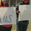 Bowling Green State University students stand outside the Pi Kappa Alpha house on March 9, 2021 calling for changes to Greek life after the hazing death of Stone Foltz. (Bri Malaska/WNWO via 24 News)