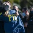 Two FBI agents embrace in a moment of mourning following a violent shootout in Sunrise, Florida. Two FBI agents embrace in a moment of mourning following a violent shootout in Sunrise, Florida.