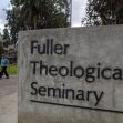Signage for Fuller Theological Seminary at its campus, with individuals walking in the background. Signage for Fuller Theological Seminary at its campus, with individuals walking in the background.