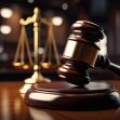 A gavel and scales of justice on a wooden table, symbolizing legal proceedings and court rulings. A gavel and scales of justice on a wooden table, symbolizing legal proceedings and court rulings.