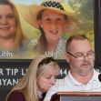 A man speaking at a press conference with images of two teens, Libby German and Abby Williams, displayed in the background. A man speaking at a press conference with images of two teens, Libby German and Abby Williams, displayed in the background.