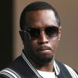 Image of Sean 'Diddy' Combs wearing sunglasses, appearing serious. Image of Sean 'Diddy' Combs wearing sunglasses, appearing serious.