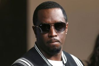 Image of Sean 'Diddy' Combs wearing sunglasses, appearing serious.