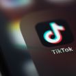 Close-up of the TikTok app icon on a smartphone screen. Close-up of the TikTok app icon on a smartphone screen.
