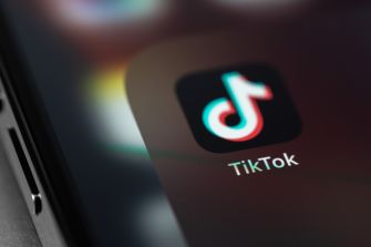Close-up of the TikTok app icon on a smartphone screen.