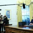 President Joe Biden signs executive orders in the Oval Office of the White House, January 20, 2021.