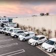 A row of vehicles belonging to Protech Construction parked outside a building, showcasing the company's branding and logo. A row of vehicles belonging to Protech Construction parked outside a building, showcasing the company's branding and logo.