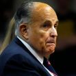 Rudy Giuliani looking serious during a public appearance. Rudy Giuliani looking serious during a public appearance.