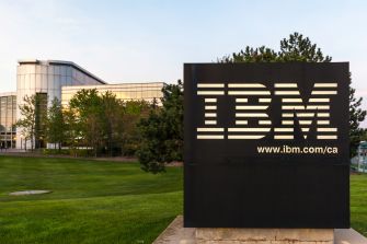 Signage for IBM's office building, showcasing the company logo and website.
