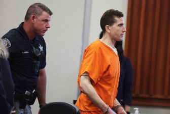 Bryan Kohberger being led into the courtroom during his sentencing for the murders of four University of Idaho students.