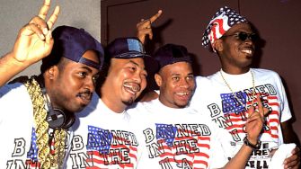 Members of 2 Live Crew posing together, wearing matching shirts that say "BANNED IN THE U.S.A."